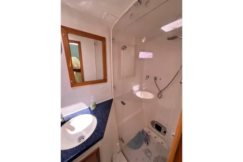 Slide: The Image of Bathroom interior of 2008 Admiral 40 Cruiser with shower and sink. - 64