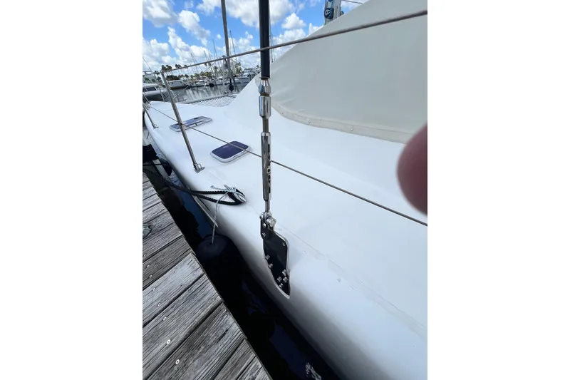 Slide: The Image of 2008 Admiral 40 Cruiser yacht docked, showing deck details and rigging. - 16