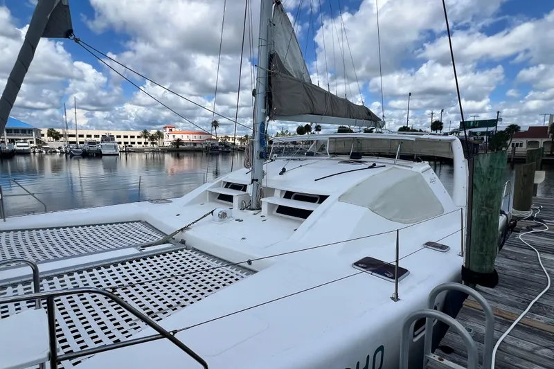 Slide: The Image of 2008 Admiral 40 Cruiser yacht docked at marina under cloudy sky. - 7