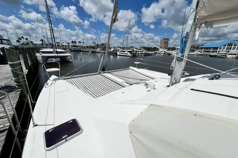 Slide: The Image of 2008 Admiral 40 Cruiser yacht docked at marina under blue sky with clouds. - 19