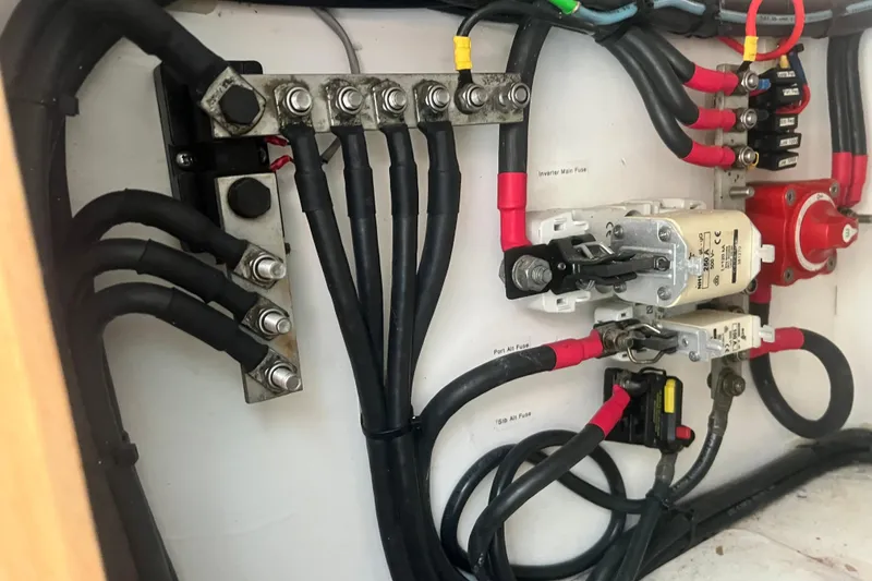 Slide: The Image of Electrical wiring and fuses inside a 2008 Admiral 40 Cruiser boat. - 69