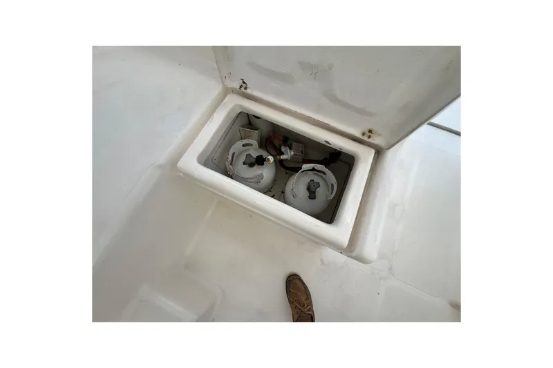 Slide: The Image of Storage compartment with propane tanks on a 2008 Admiral 40 cruiser boat. - 38