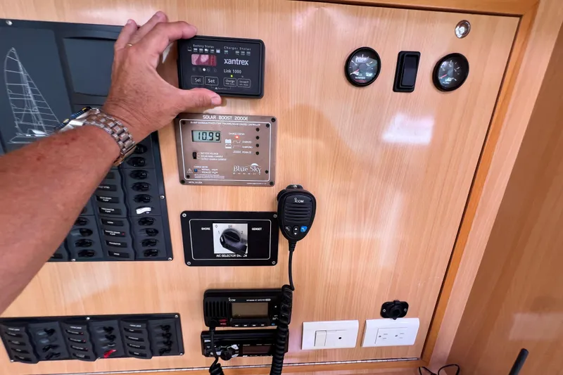 Slide: The Image of Control panel of a 2008 Admiral 40 Cruiser with various gauges and switches. - 49