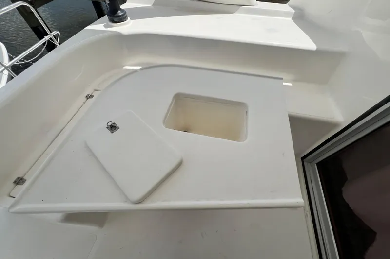 Slide: The Image of White deck area on a 2008 Admiral 40 Cruiser yacht, featuring a storage compartment. - 37
