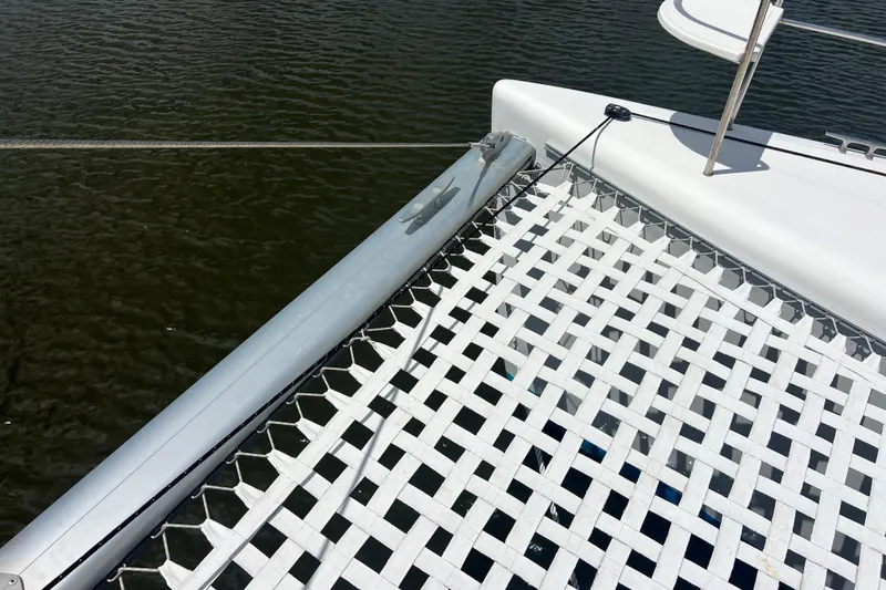 Slide: The Image of Catamaran netting on 2008 Admiral 40 Cruiser over water. - 25