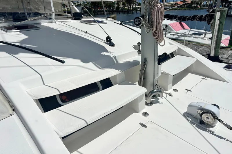 Slide: The Image of Deck view of a 2008 Admiral 40 Cruiser yacht docked at a marina. - 29