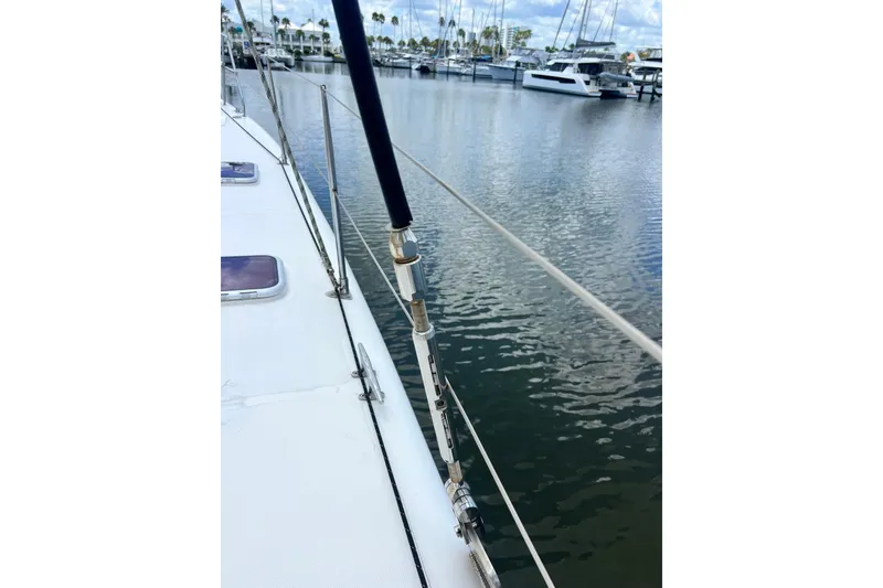 Slide: The Image of 2008 Admiral 40 Cruiser sailboat deck view at marina with calm water. - 14