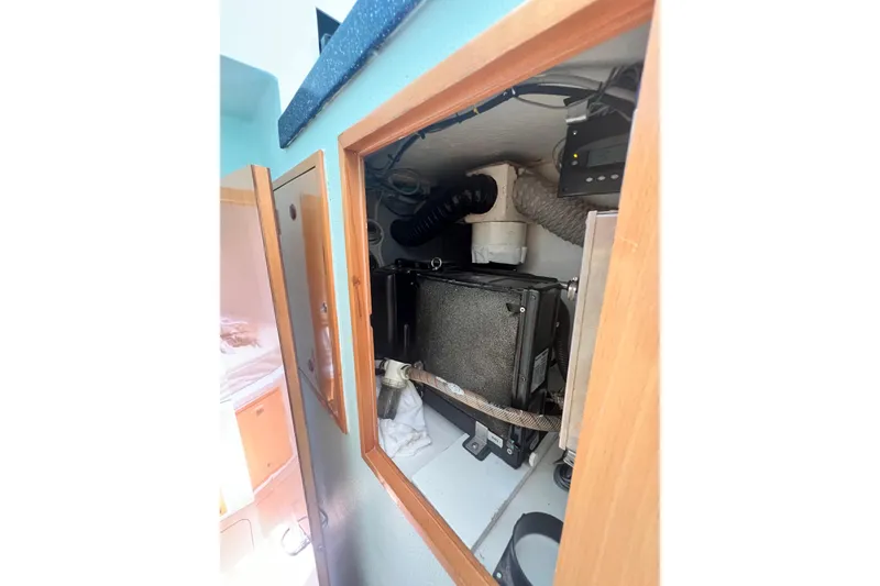 Slide: The Image of Interior view of 2008 Admiral 40 cruiser showing mechanical components and storage area. - 80