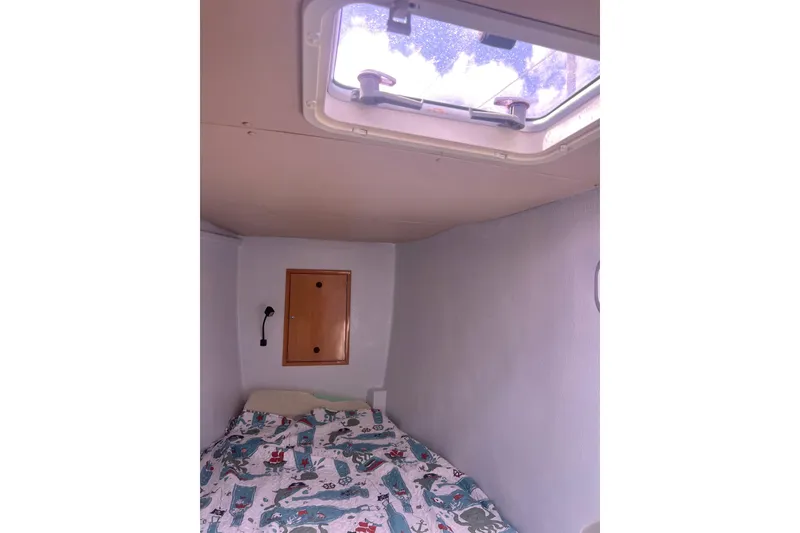 Slide: The Image of Cozy cabin interior of 2008 Admiral 40 cruiser with bed and ceiling hatch. - 66