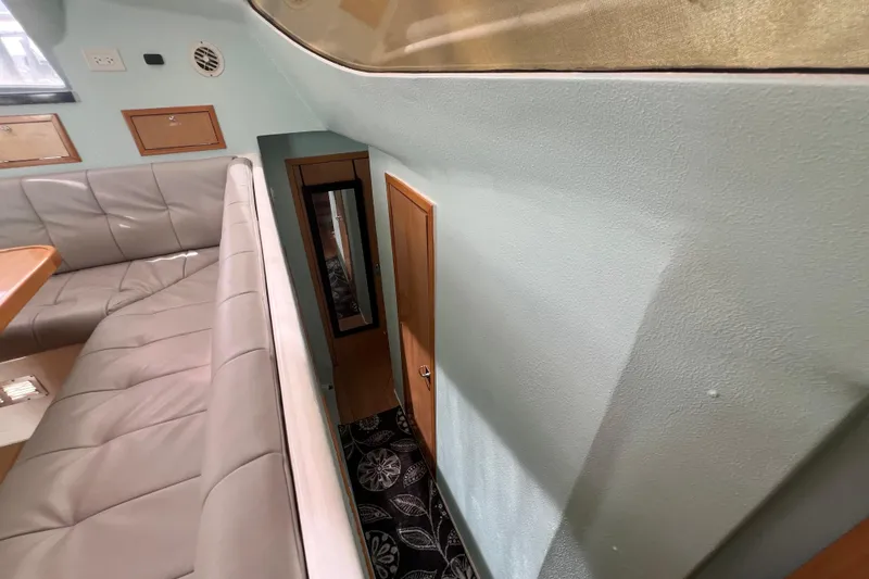 Slide: The Image of Interior of 2008 Admiral 40 Cruiser with seating and wooden accents. - 54