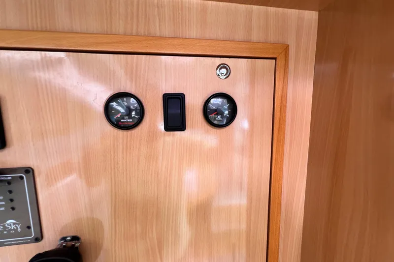 Slide: The Image of Wooden panel with gauges on a 2008 Admiral 40 Cruiser yacht interior. - 51
