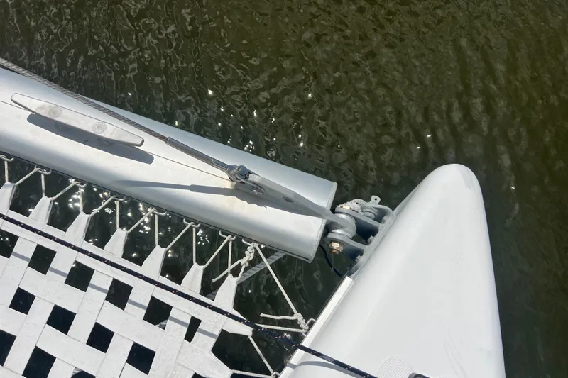 Slide: The Image of Top view of 2008 Admiral 40 cruiser catamaran's bow and netting over water. - 28