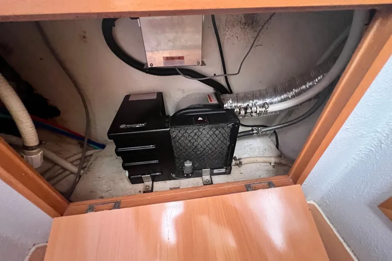 Slide: The Image of Electrical compartment of a 2008 Admiral 40 cruiser with wiring and equipment. - 77
