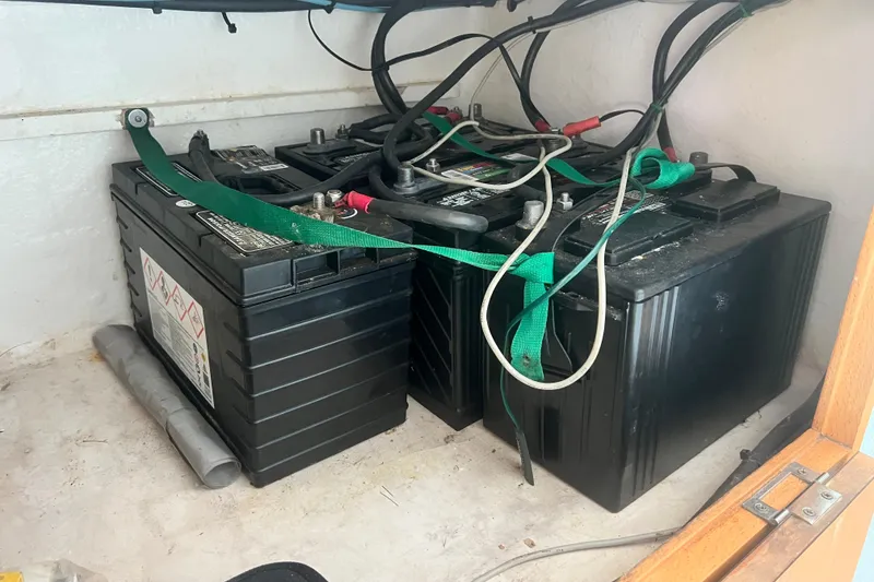 Slide: The Image of Battery compartment of a 2008 Admiral 40 cruiser with secured wiring. - 68