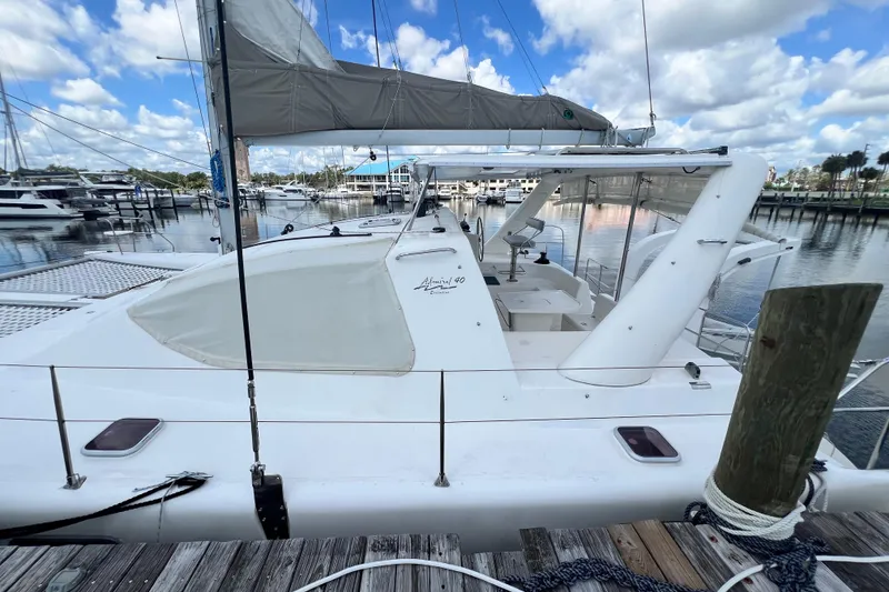 Slide: The Image of 2008 Admiral 40 Cruiser yacht docked at marina under blue sky. - 8