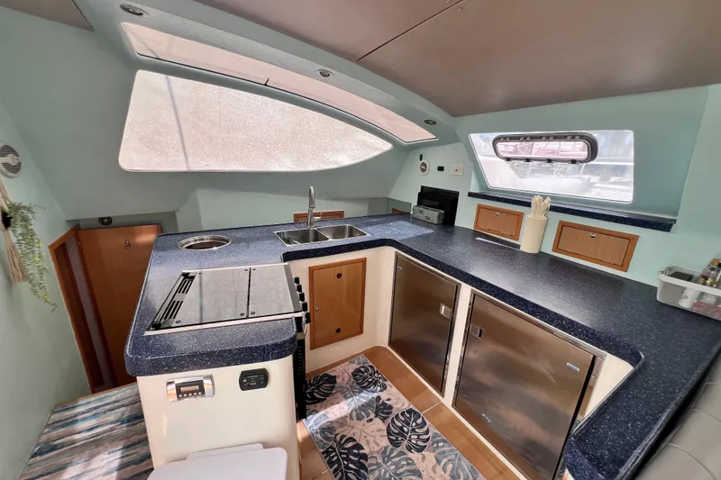 Slide: The Image of Modern kitchen interior of 2008 Admiral 40 Cruiser yacht with sleek countertops and appliances. - 42