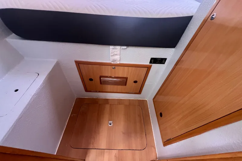 Slide: The Image of Interior cabin of 2008 Admiral 40 cruiser with wooden panels and storage compartments. - 72