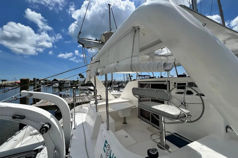 Slide: The Image of 2008 Admiral 40 Cruiser yacht docked at marina under blue sky. - 34