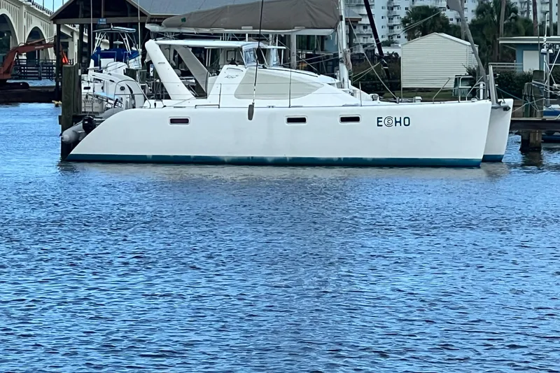 Slide: The Image of 2008 Admiral 40 Cruiser yacht docked at marina, calm water, clear day. - 2