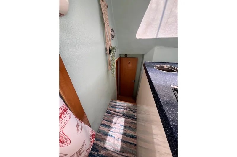 Slide: The Image of Interior of 2008 Admiral 40 Cruiser with compact kitchen and narrow hallway. - 70