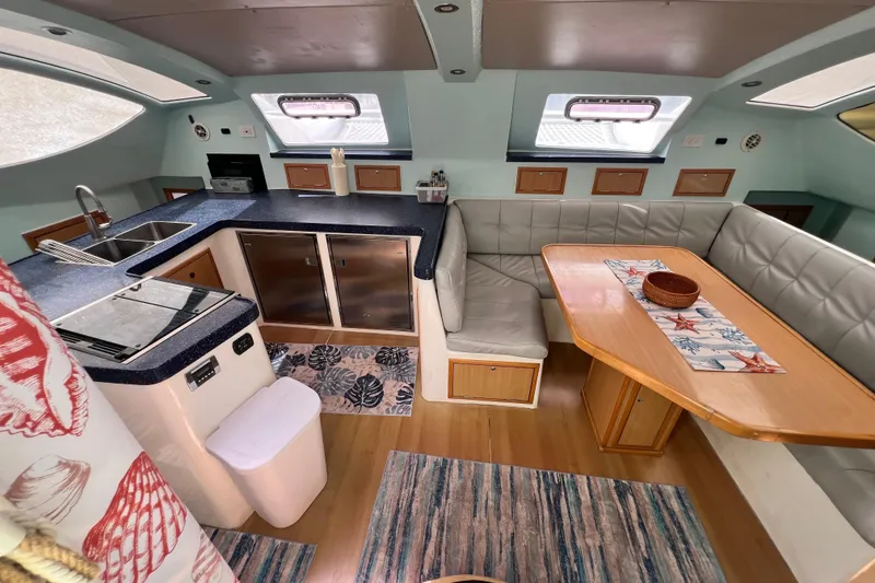 Slide: The Image of Interior of 2008 Admiral 40 cruiser with kitchen and dining area. - 41