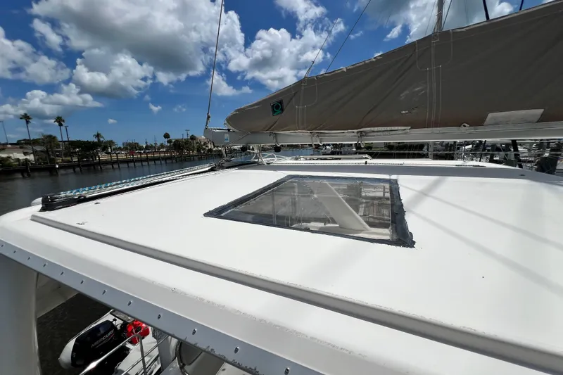 Slide: The Image of 2008 Admiral 40 Cruiser sailboat deck with clear sky and marina backdrop. - 32