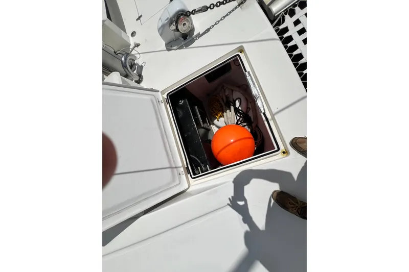 Slide: The Image of Open storage compartment on 2008 Admiral 40 cruiser with orange buoy and ropes. - 30