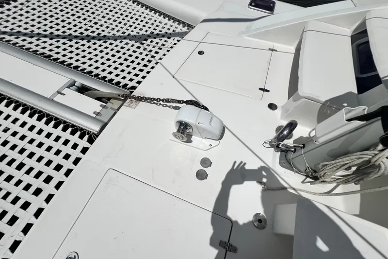 Slide: The Image of Deck of 2008 Admiral 40 Cruiser with winch, ropes, and shadow. - 21
