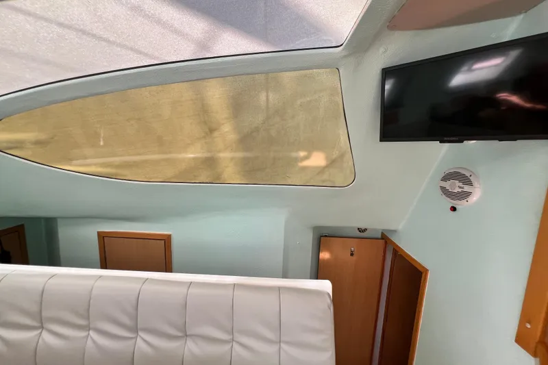 Slide: The Image of Interior of 2008 Admiral 40 Cruiser with TV, window, and seating. - 53