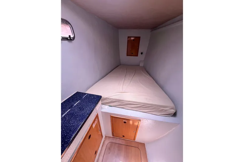 Slide: The Image of Cozy cabin interior of 2008 Admiral 40 cruiser with bed and storage. - 87