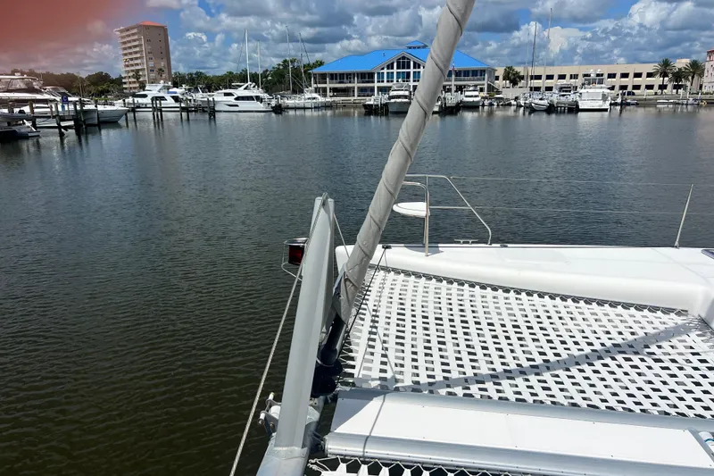 Slide: The Image of Sailboat docked in marina, Admiral 40 Cruiser, 2008 model, with waterfront buildings in background. - 27
