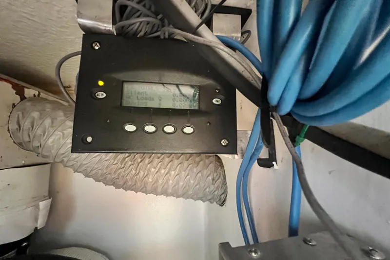 Slide: The Image of Control panel with cables in a 2008 Admiral 40 Cruiser yacht. - 81