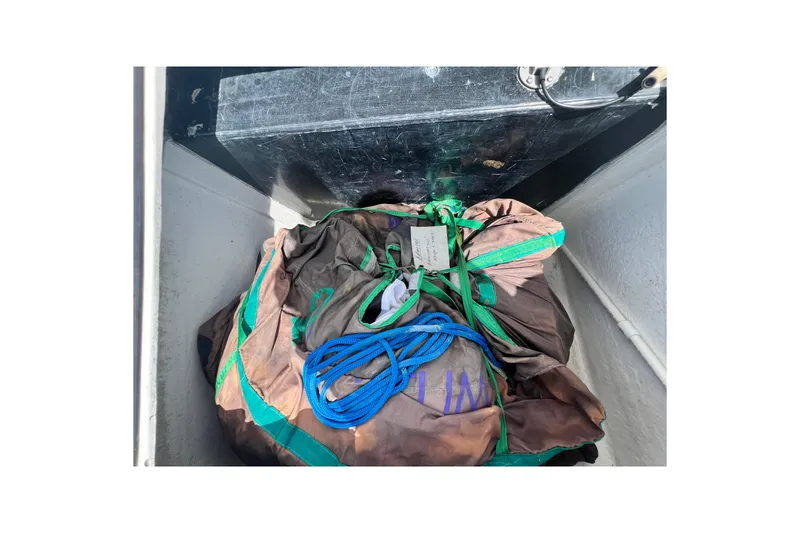 Slide: The Image of Storage compartment on a 2008 Admiral 40 cruiser with ropes and gear. - 23
