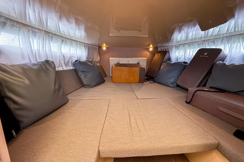 Slide: The Image of Luxurious interior cabin of 2023 Invictus GT280S with plush seating and ambient lighting. - 25