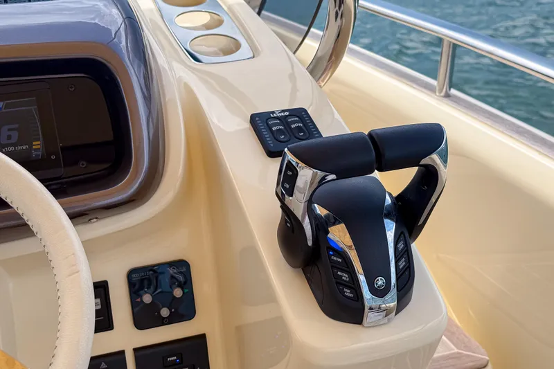 Slide: The Image of Control panel of 2023 Invictus GT280S boat with throttle and display. - 21
