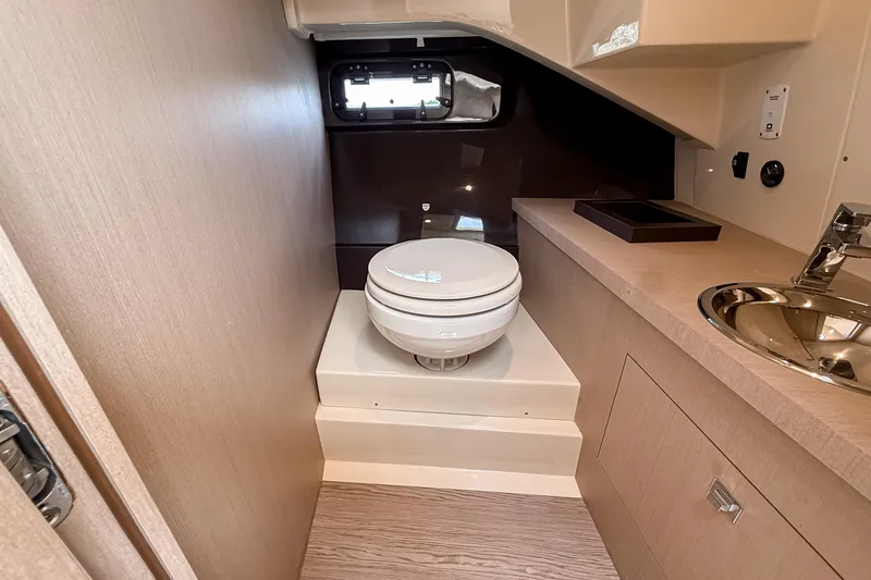Slide: The Image of 2023 Invictus GT280S yacht bathroom with modern fixtures and compact design. - 26