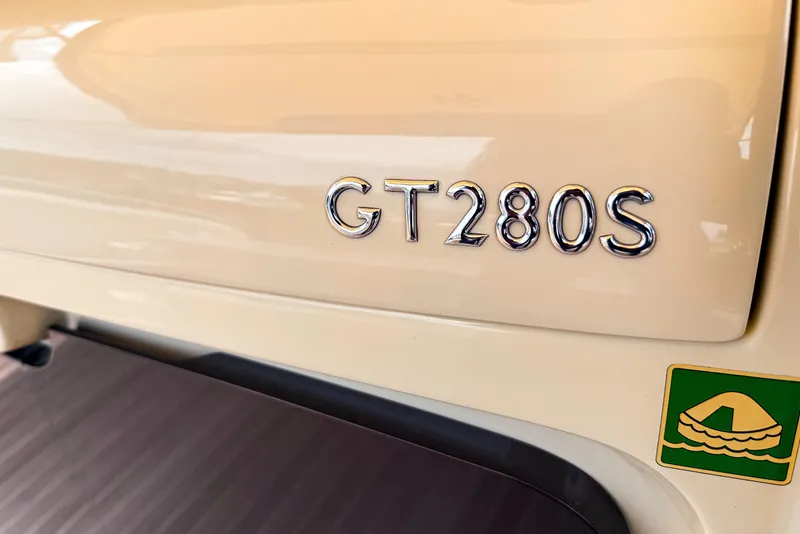 Slide: The Image of 2023 Invictus GT280S emblem on beige surface, showcasing sleek design. - 31