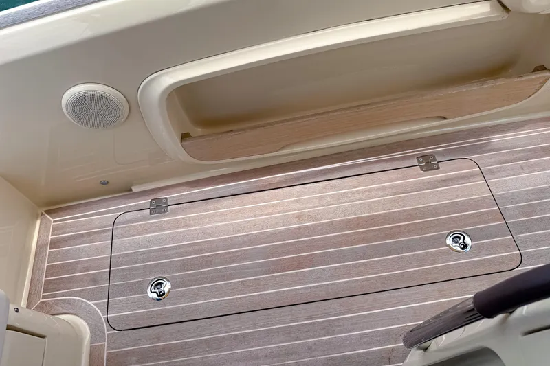 Slide: The Image of 2023 Invictus GT280S boat deck with storage hatch and speaker. - 16