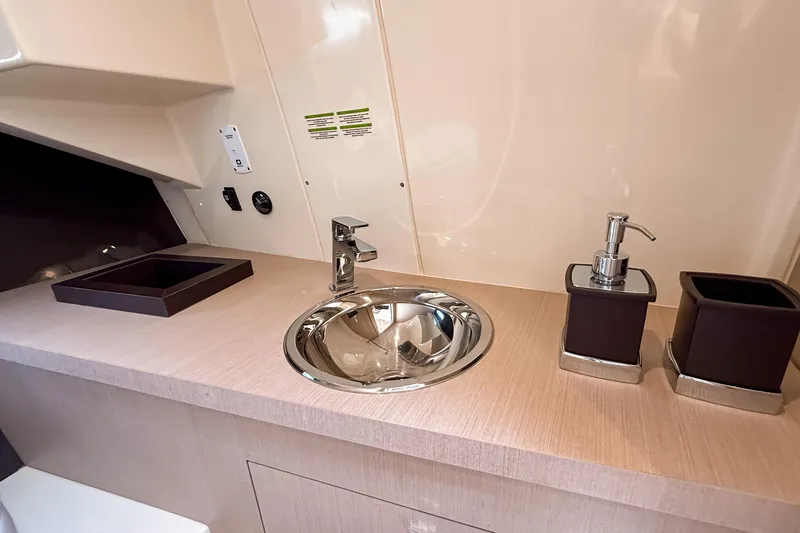 Slide: The Image of 2023 Invictus GT280S yacht interior with modern sink and countertop accessories. - 27