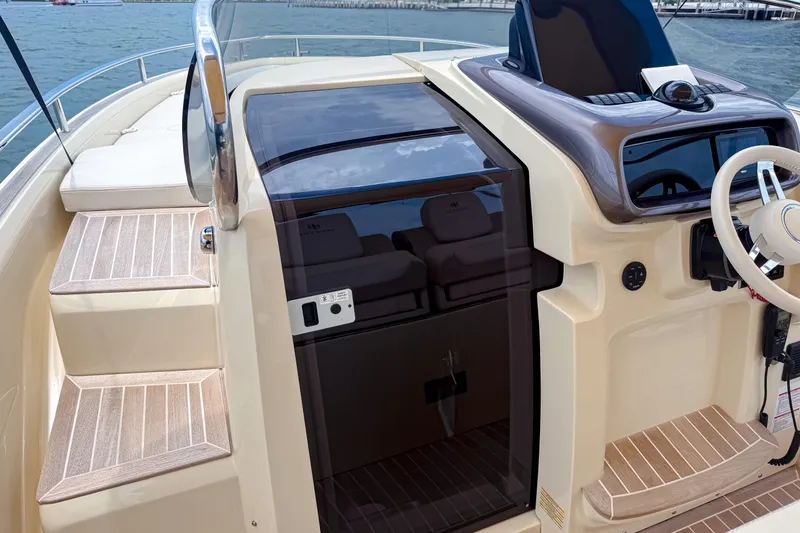 Slide: The Image of 2023 Invictus GT280S boat cockpit with sleek design and modern controls. - 18