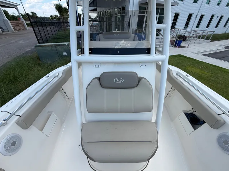 Slide: The Image of Key West 239 FS 2023: Foredeck with seating and helm console, surrounded by modern buildings. - 14