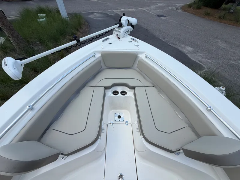 Slide: The Image of The image shows the bow of a 2023 Key West 239 FS boat with beige cushions. - 16