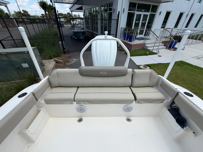 Slide: The Image of The image shows the stern of a Key West 239 FS boat with beige seating. - 5