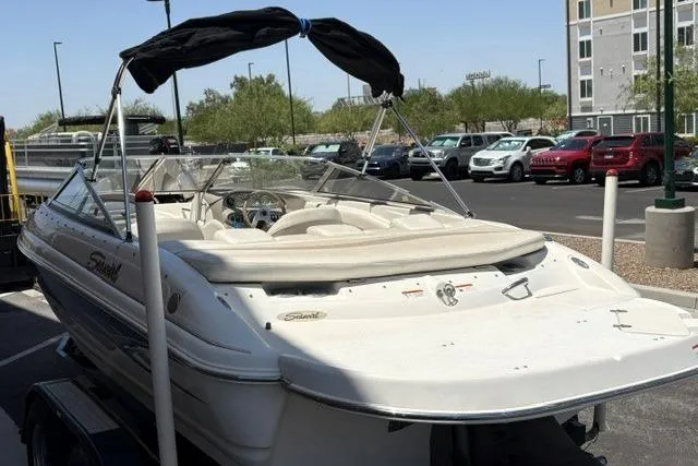 Slide: The Image of 2006 Seaswirl 190 Bowrider I/O boat parked in a lot, rear view. - 1