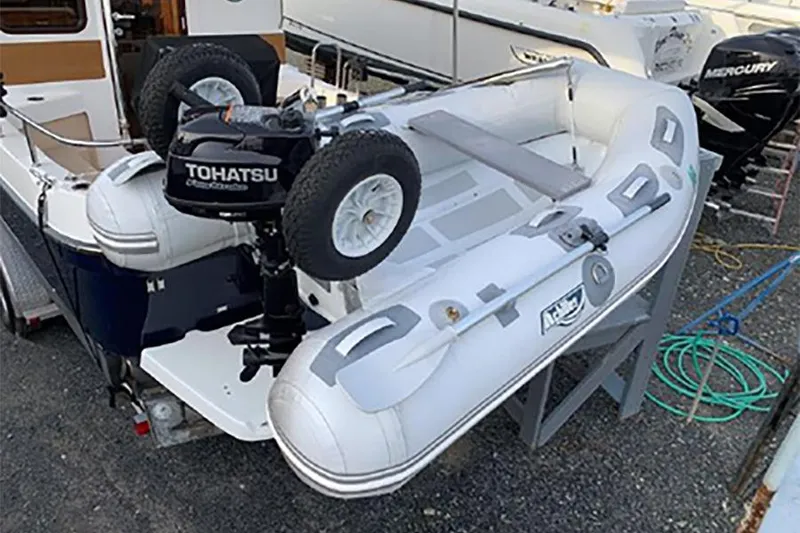 Slide: The Image of Inflatable dinghy with Tohatsu motor on 2016 Ranger Tugs R-27 boat. - 11
