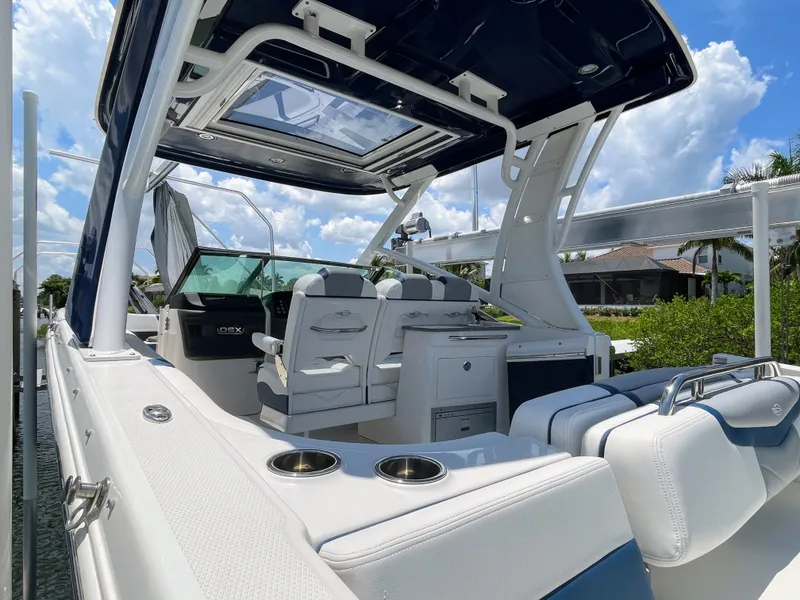 Slide: The Image of The image shows a 2023 Chaparral 280OSX boat with luxurious interior and modern design. - 21