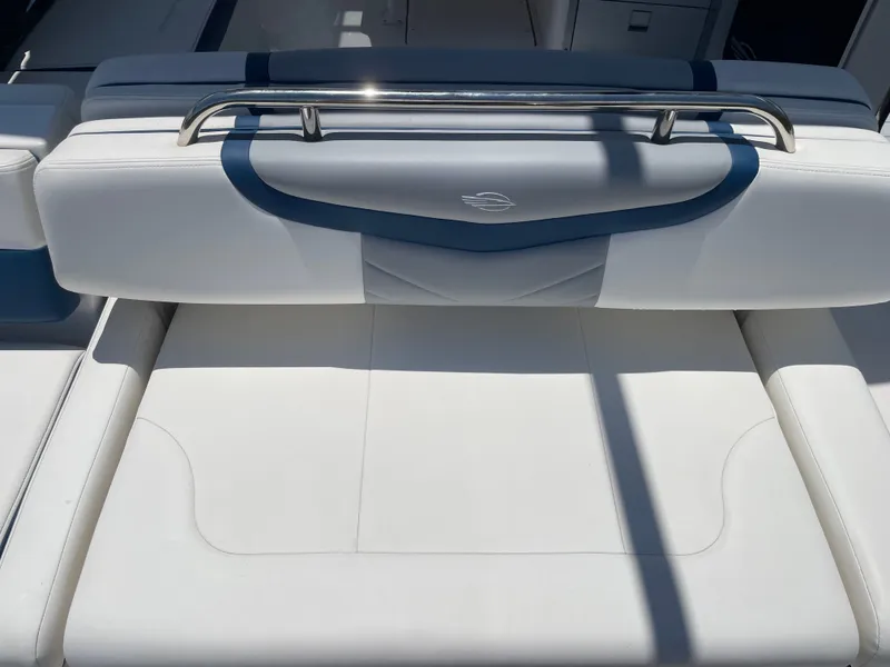 Slide: The Image of The 2023 Chaparral 280OSX features a stylish, cushioned bench seat with a stainless steel handle. - 27