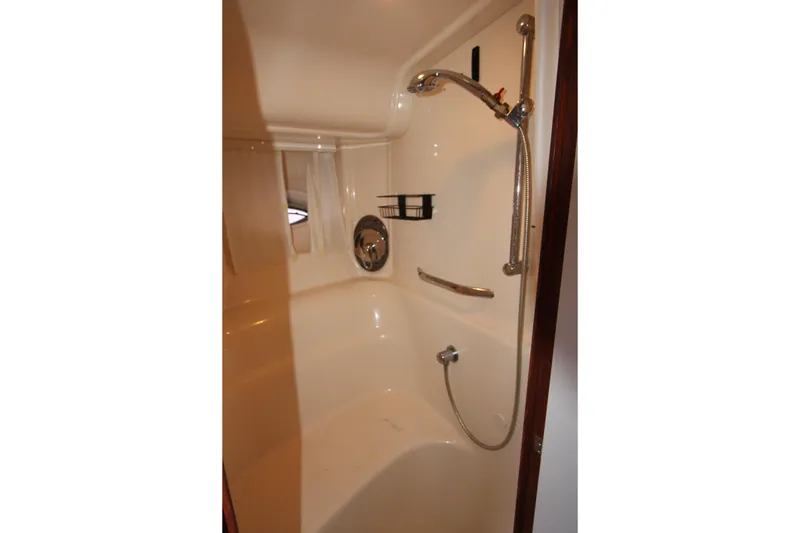 Slide: The Image of Shower area in 2005 Sea Ray 420 Sundancer yacht, featuring sleek design and chrome fixtures. - 25
