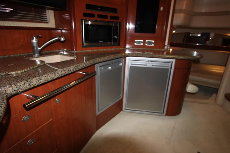 Slide: The Image of Luxurious kitchen area in a 2005 Sea Ray 420 Sundancer yacht with granite countertops. - 20