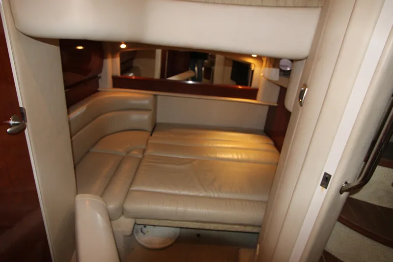 Slide: The Image of Interior cabin of 2005 Sea Ray 420 Sundancer with beige leather seating. - 22